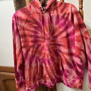 volcom hoodie. tie dyed and has brand logo on sleeve.